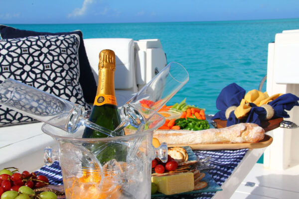 Champagne and gourmet lunch, available for custom cruises and luxury boat charters in Turks and Caicos.